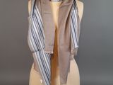grey and white striped scarf on a mannequin mannequin mannequin mannequin mannequin mannequin mannequin mannequin mann
