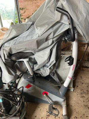 a bike that is covered with a sheet in a garage