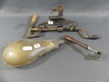 two old tools sitting on a table next to each other