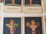 several cards with angels on them are sitting on a table
