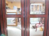 a view of a room through a glass door