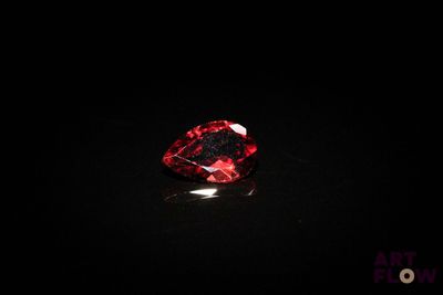 a red diamond on a black surface