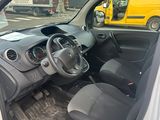 the interior of a car with the door open and the driver ' s seat down