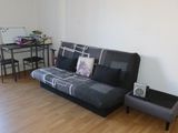 an image of a living room with a couch and a table