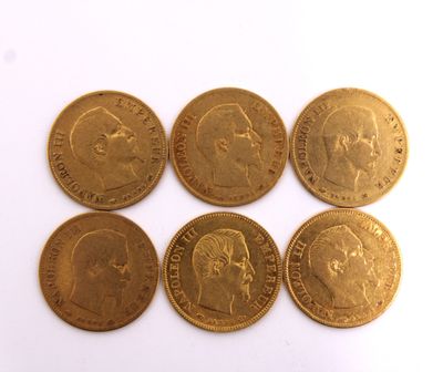six gold sovereigns of different sizes and shapes