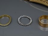 three different types of wedding rings on a table
