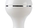 a white lamp that is on a white table