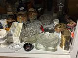 many glass items on a shelf in the window