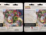 two packs of pokemon trading cards are shown on a black background