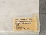 a piece of paper with a label on it sitting on a table