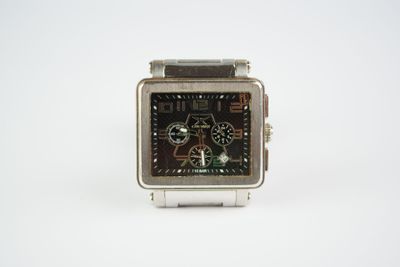 wrist watch on a white surface with a white background