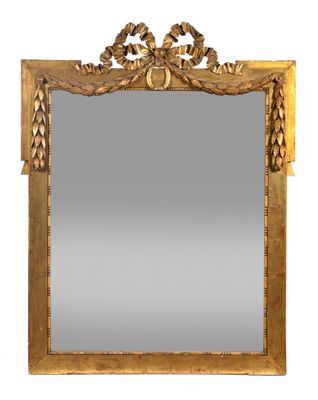 un miroir à cadre doré orné d'un motif décoratif
