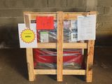a wooden pallet with a red barrel and a sign on it