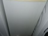 a white refrigerator and a white dishwasher in a kitchen