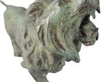 a statue of a lion with its mouth open on a white background
