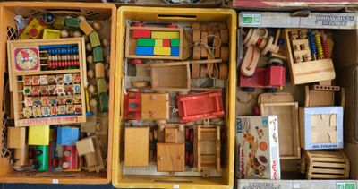 two boxes of wooden toys that are sitting on the floor