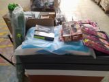 many boxes of items on a cart in a warehouse