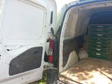 a white van that has a bunch of drawers inside of it