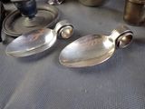silver spoons and other silverware on a table