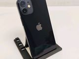 an apple iphone sitting on top of a stand on a white surface