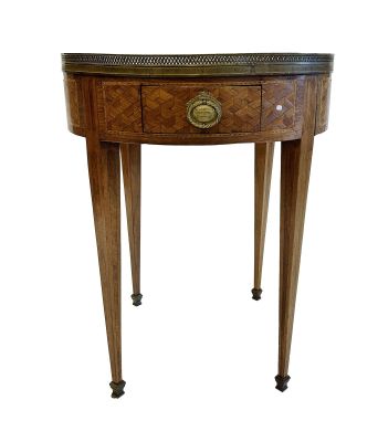 a small round table with a drawer on one side and a drawer on the other