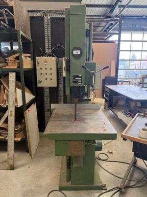 an image of a machine in a workshop with a lot of wood
