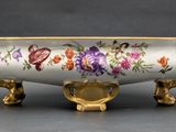 an image of a decorative bowl with flowers painted on it