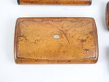 three different types of wooden items on a white surface