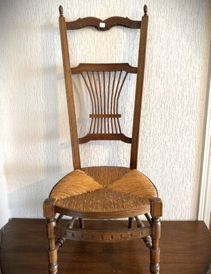 a wooden chair that is sitting on a wooden table