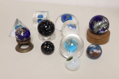 a lot of glass marbles sitting on a table