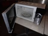 a microwave that is open on a table