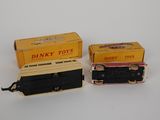 two toy trains sitting next to each other on a table