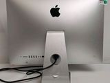 an apple computer sitting on top of a desk