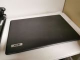 a black laptop sitting on top of a white table