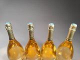 three bottles of wine that are sitting on a table