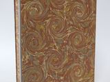 a brown and blue book with swirl designs on it