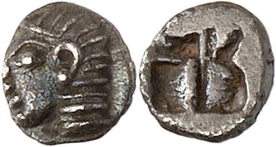 a silver coin with an image of a man and a woman on it