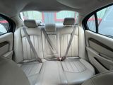 the back seats of a car with a seat belt in the back