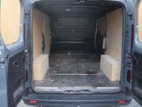 the back of a van with the door open and the back of the van with the door open