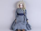 an image of a little girl in a blue dress and hat