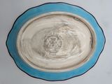 a blue and white plate with a picture of a castle on it