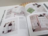 an open book with a picture of wine bottles and labels on it