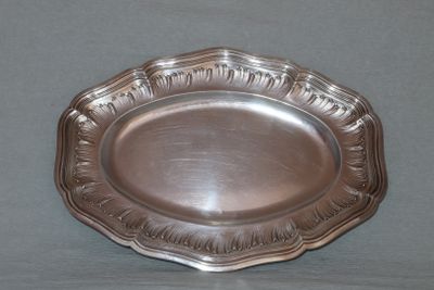 a silver plate that is on a table