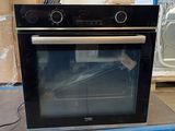 a oven that is sitting in the middle of the floor