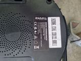 a close up of a small black device on the ground