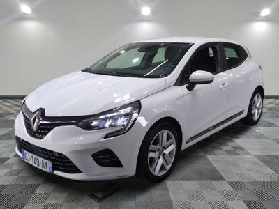 the white car is parked on a checkered tile floor