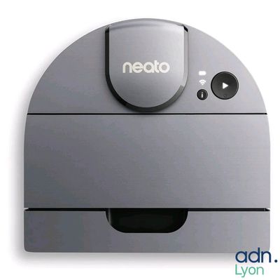 a gray robot that is sitting on a white surface