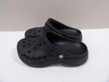 pair of black crocs shoes on a white surface