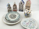 many plates and bowls that are sitting on a table
