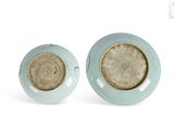 pair of blue and white vases on a white background